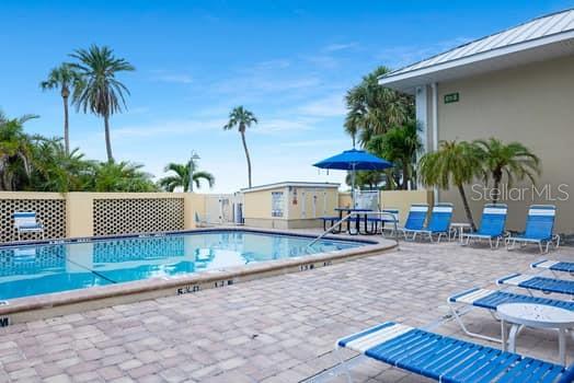 611 Destiny Drive, Unit 210 Ruskin, FL 33570 - Photo 25 of 48 a view of a backyard and swimming pool