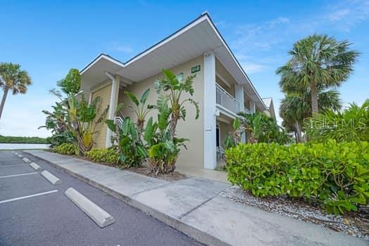 611 Destiny Drive, Unit 210 Ruskin, FL 33570 - Photo 26 of 48 a front view of a house with garden