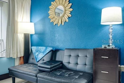 611 Destiny Drive, Unit 210 Ruskin, FL 33570 - Photo 34 of 48 a living room with furniture and a lamp