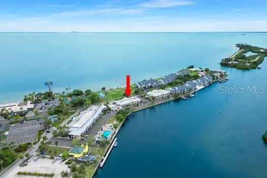 an aerial view of a houses with a lake view