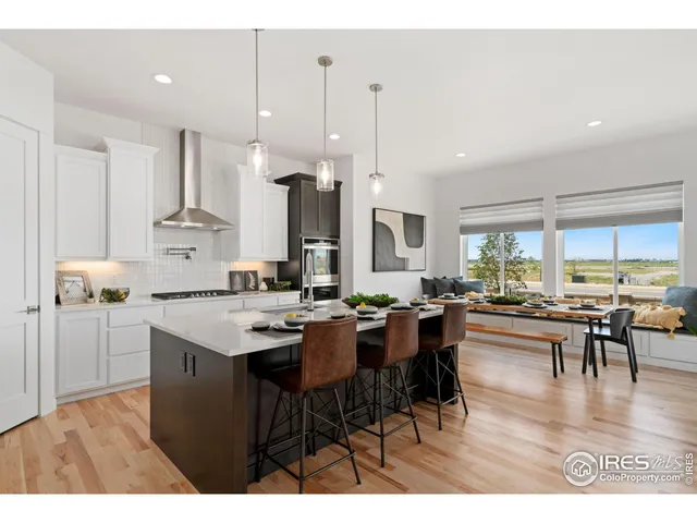 a kitchen with lots of counter top space and stainless steel appliances