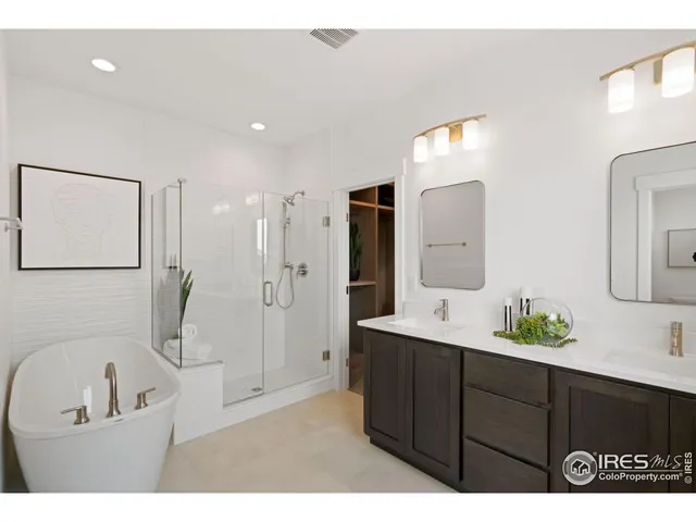 a bathroom with a sink a tub and a mirror
