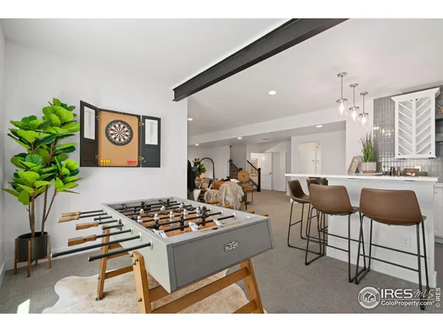 a kitchen with a sink window and cabinets