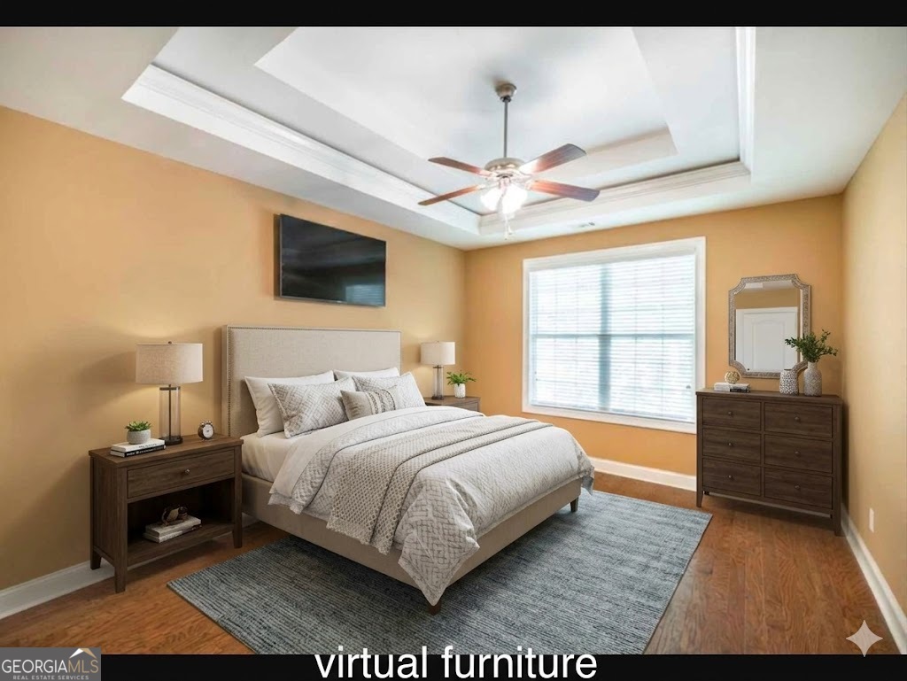 206 Londe Lane Perry, GA 31069 - Photo 17 of 37 a bedroom with a bed and a flat screen tv