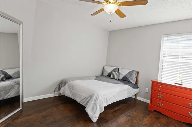 a bed room with a bed and a window