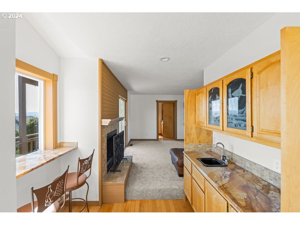 652 Northwest View Ridge Way Camas, WA 98607 - Photo 12 of 39 a living room with furniture a flat screen tv and a fireplace