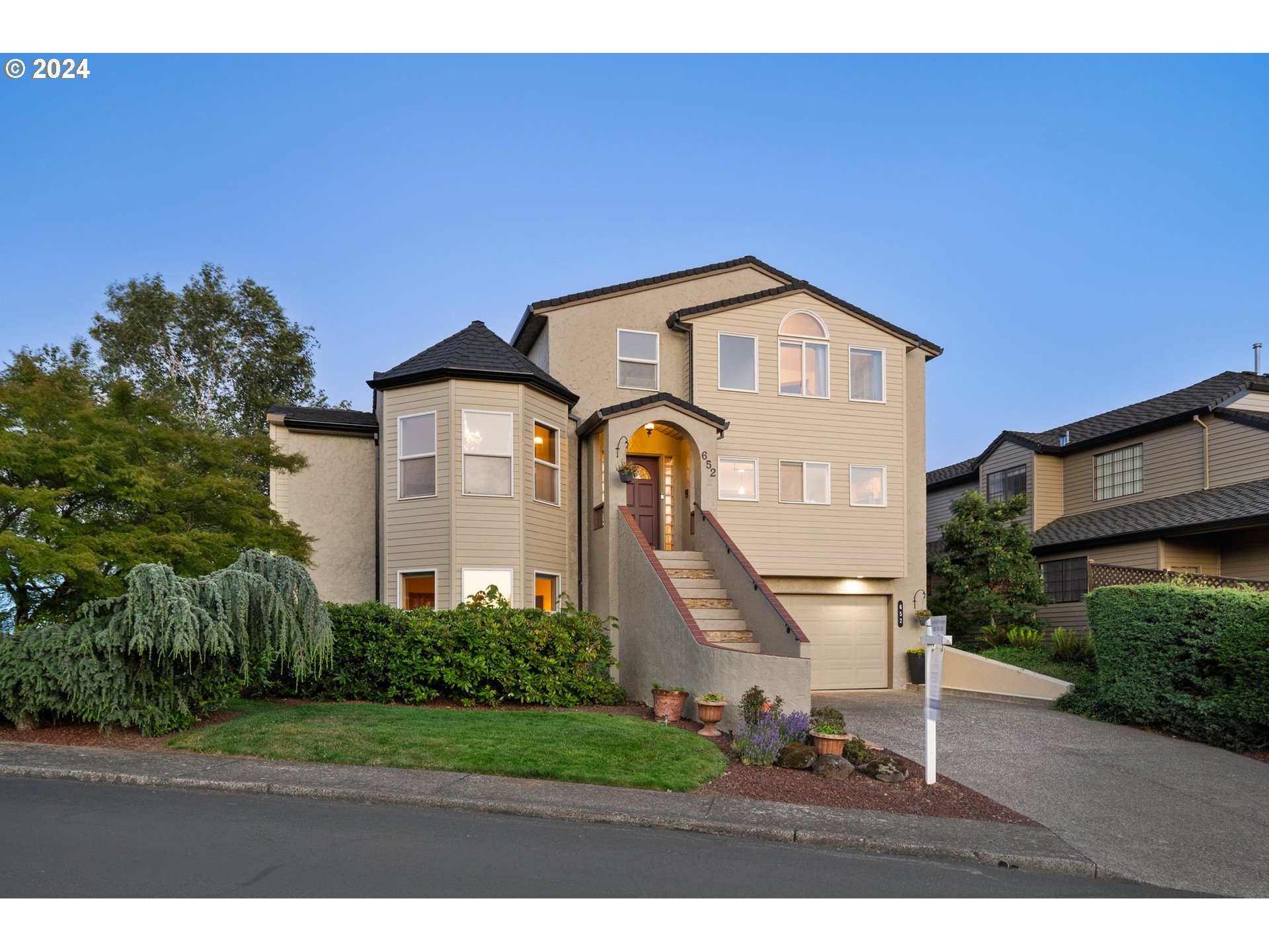652 Northwest View Ridge Way Camas, WA 98607 - Photo 2 of 39 a front view of a house with a yard