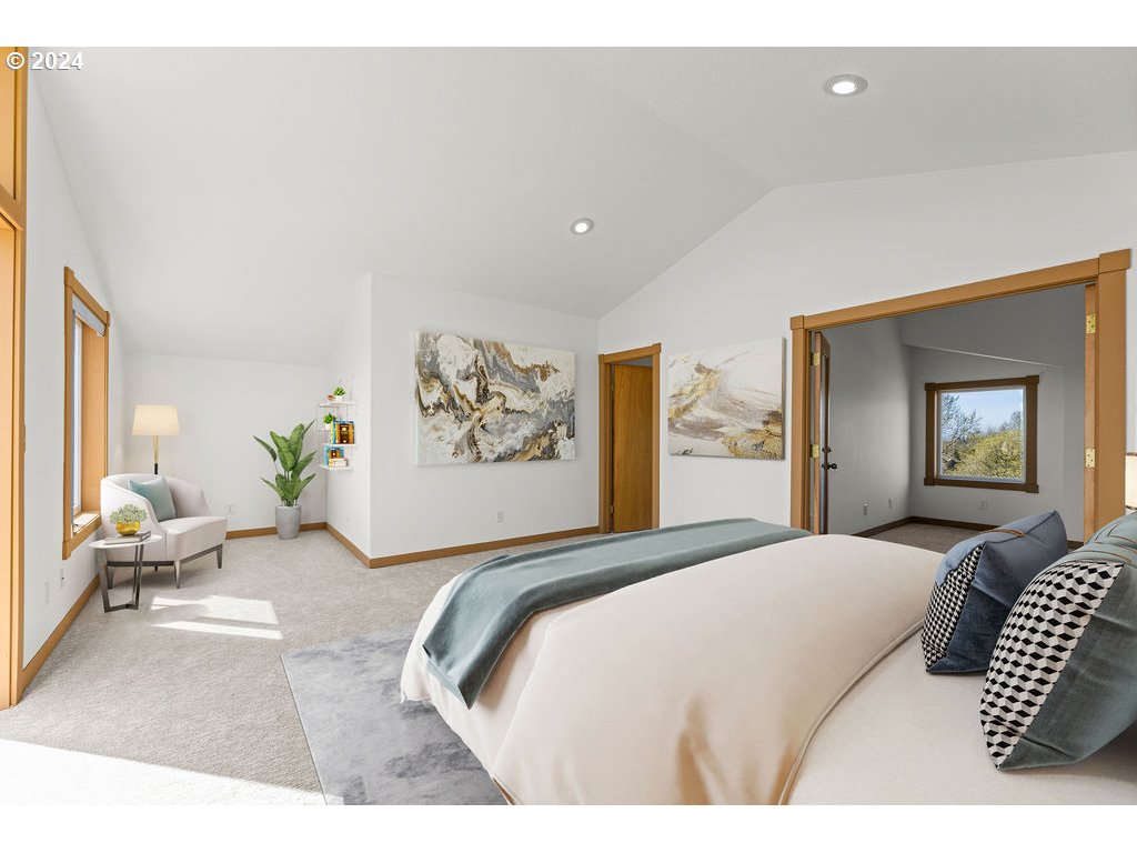 652 Northwest View Ridge Way Camas, WA 98607 - Photo 24 of 39 a bedroom with a large bed and a couch