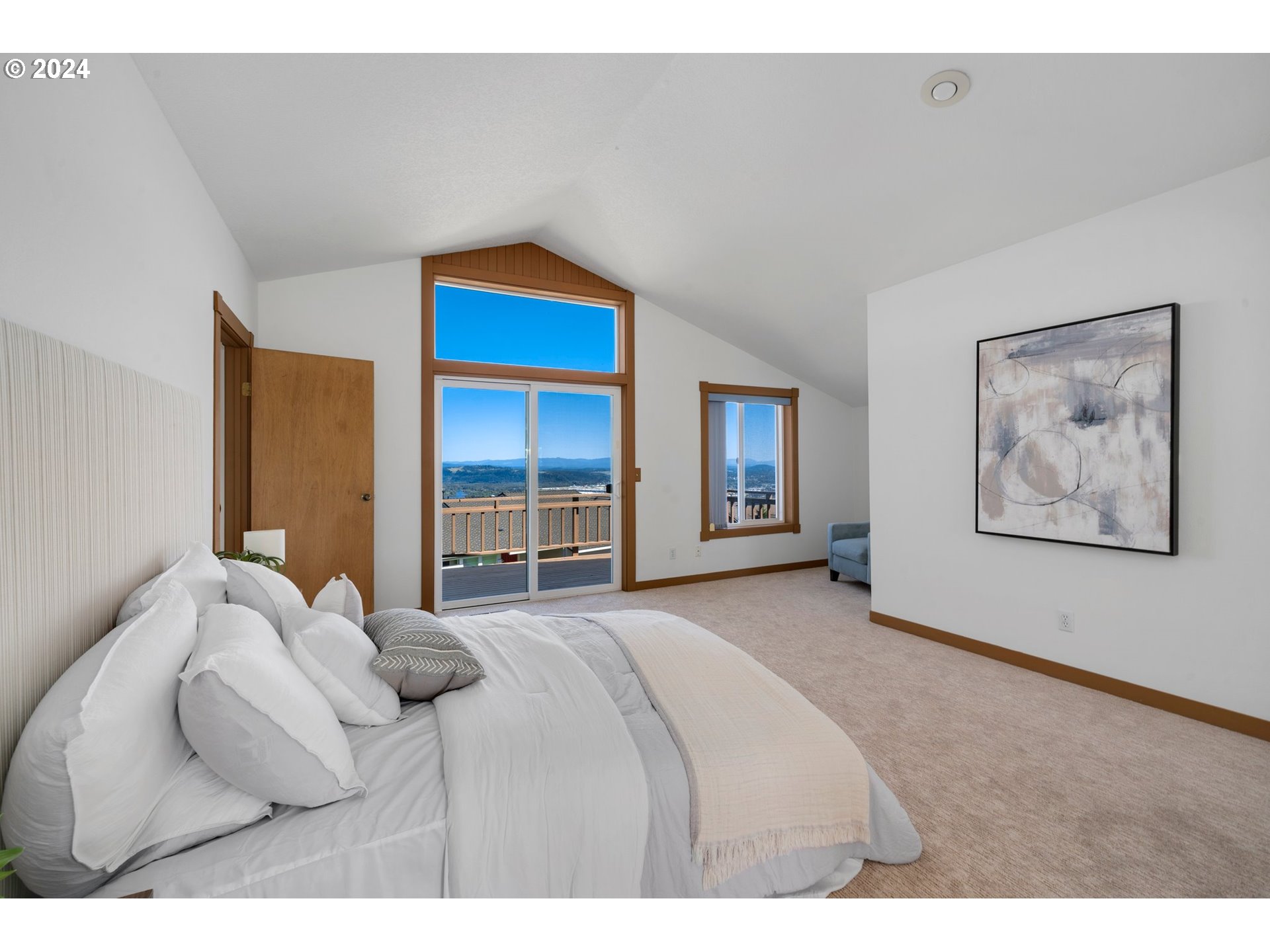 652 Northwest View Ridge Way Camas, WA 98607 - Photo 25 of 39 a bedroom with a bed and a painting on the wall