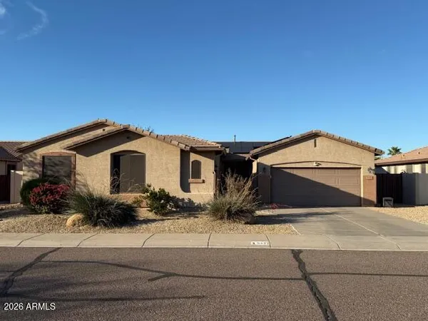 a front view of a house with a garage