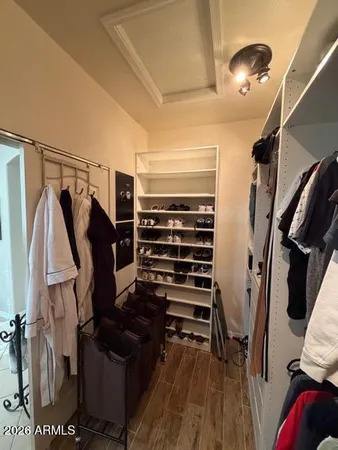 a view of a refrigerator and a microwave in a kitchen