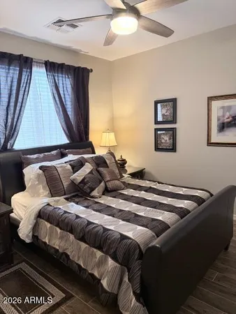 a bathroom with a double vanity sink a toilet and mirror