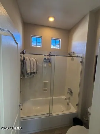 a utility room with closet dryer and washer
