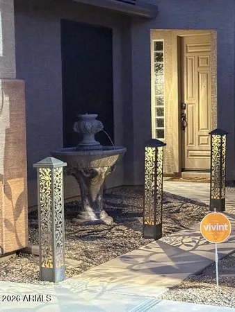 a view of a hallway with wooden floor and furniture