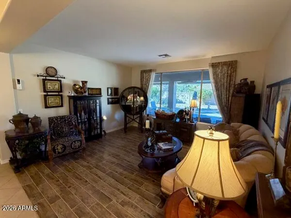 a living room with furniture window and a flat screen tv