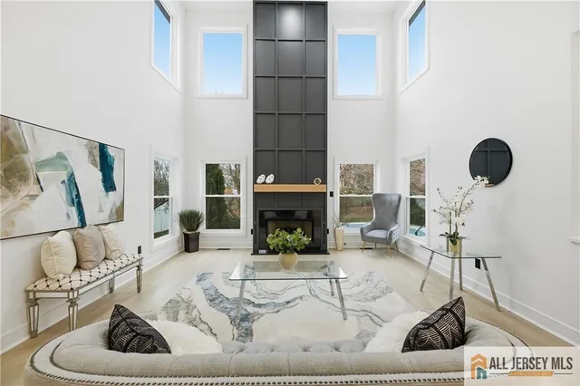 a living room with fireplace furniture and a fireplace
