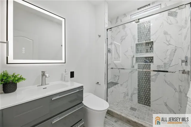 a spacious bedroom with a large bed and a couch