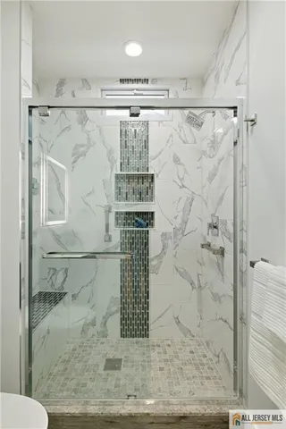 a bathroom with a sink a bathtub and a window