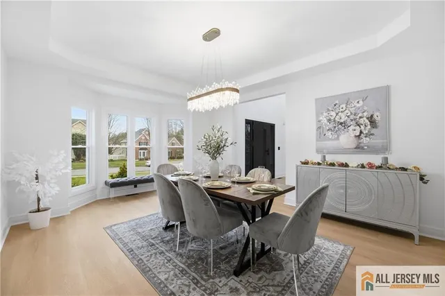 a view of a dining room with furniture and window