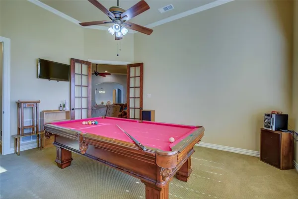 a bed room with a bed and a chandelier