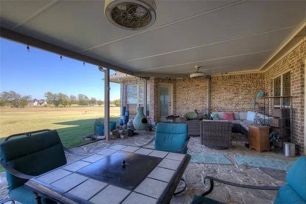 a house view with a swimming pool and wooden fence