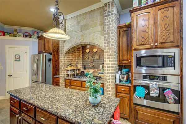 a kitchen with a refrigerator and a sink