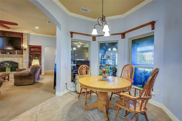 a view of a livingroom with furniture and a chandelier