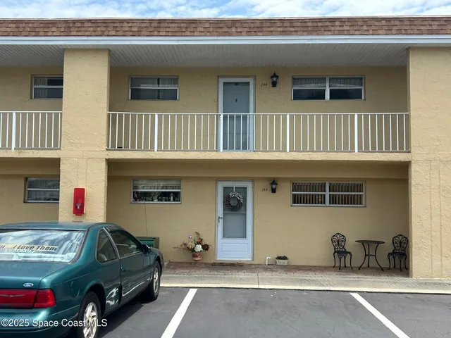 a view of a car park in front of house