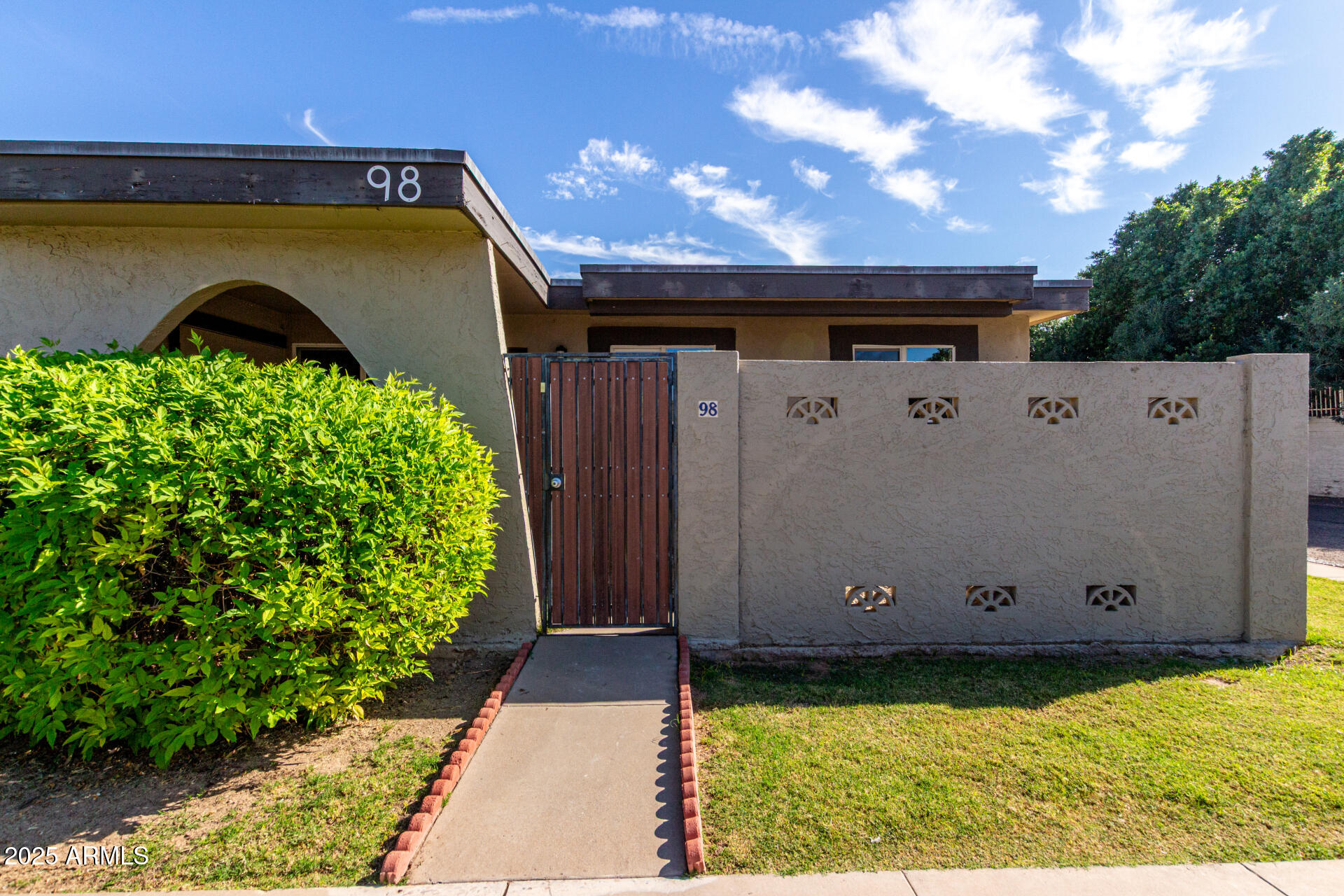 830 South Dobson Road, Unit 98 Mesa, AZ 85202 - Photo 1 of 25 a view of a back yard of the house