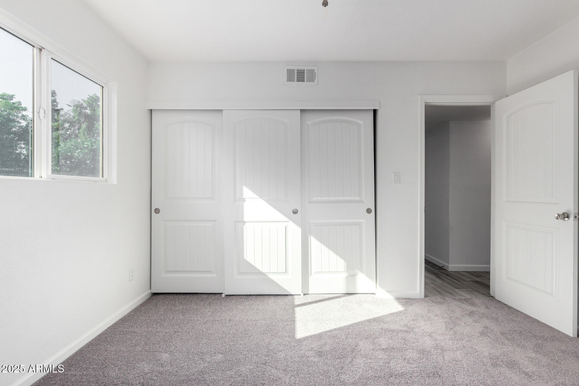 830 South Dobson Road, Unit 98 Mesa, AZ 85202 - Photo 14 of 25 a view of an empty room with a window