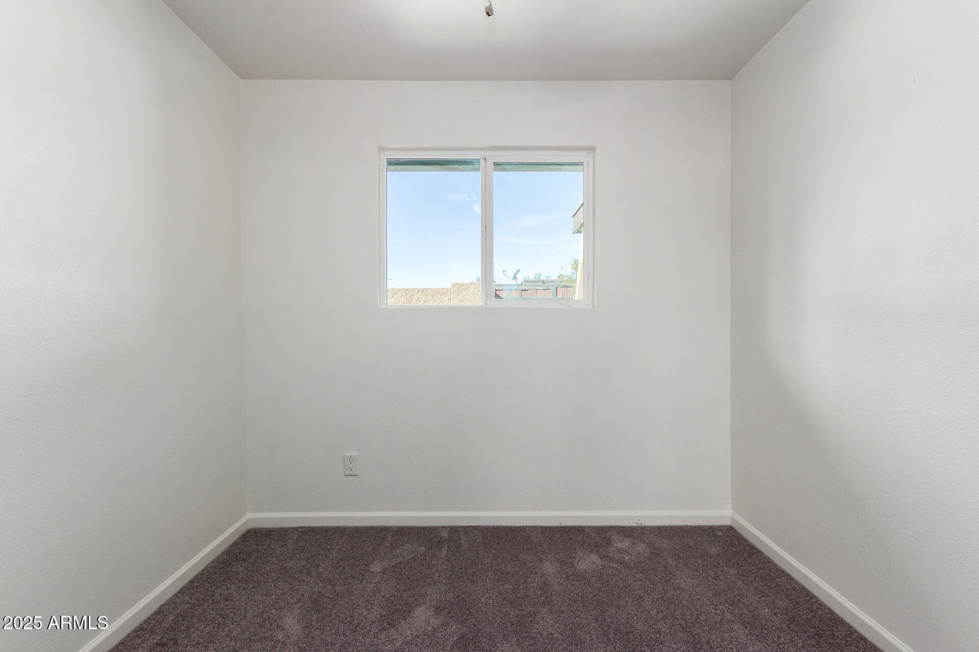 830 South Dobson Road, Unit 98 Mesa, AZ 85202 - Photo 20 of 25 an empty room with a window