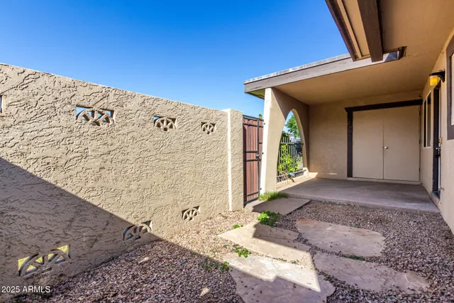 a front view of a house with mountain