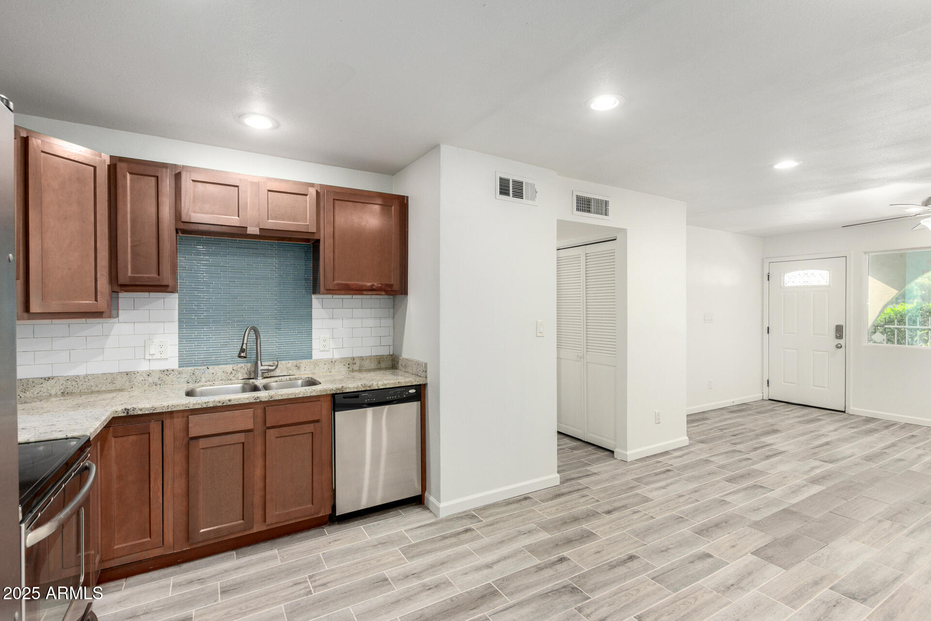 830 South Dobson Road, Unit 98 Mesa, AZ 85202 - Photo 8 of 25 a kitchen with a sink cabinets and wooden floor
