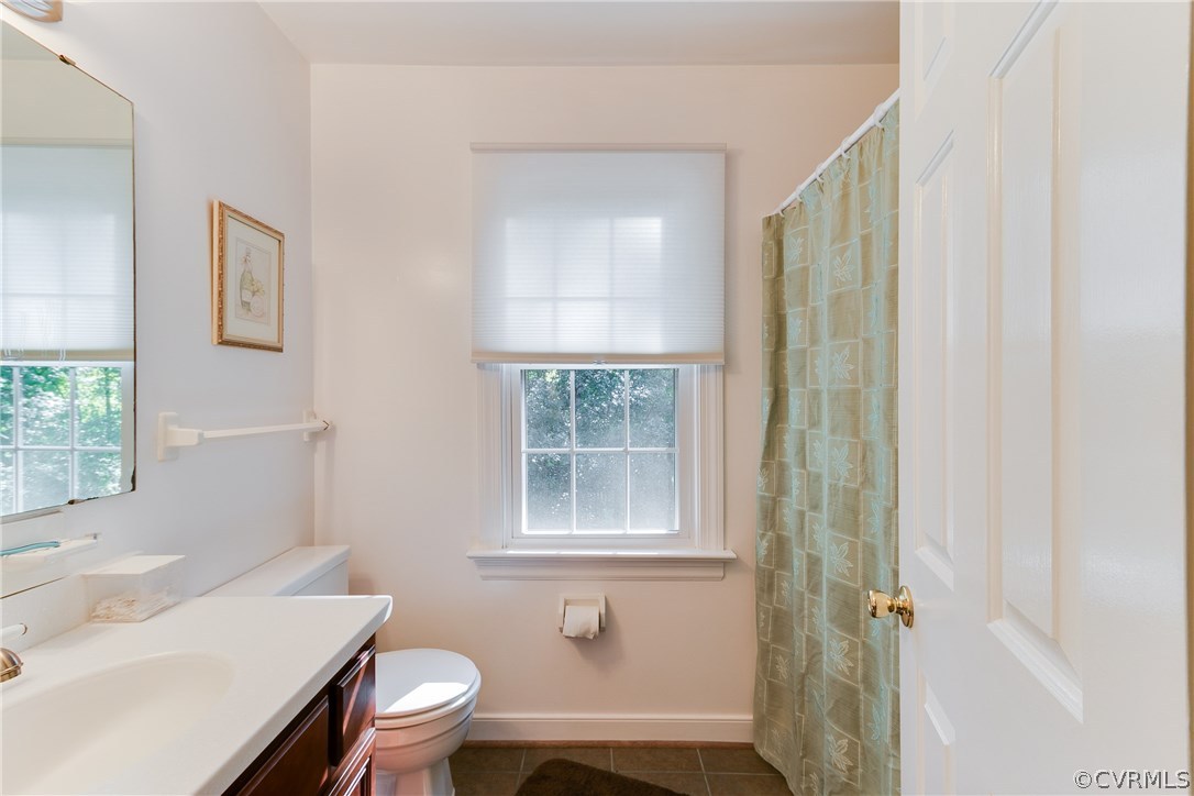 2512 Tanglebrook Road Midlothian, VA 23112 - Photo 14 of 23 a bathroom with a sink toilet and shower