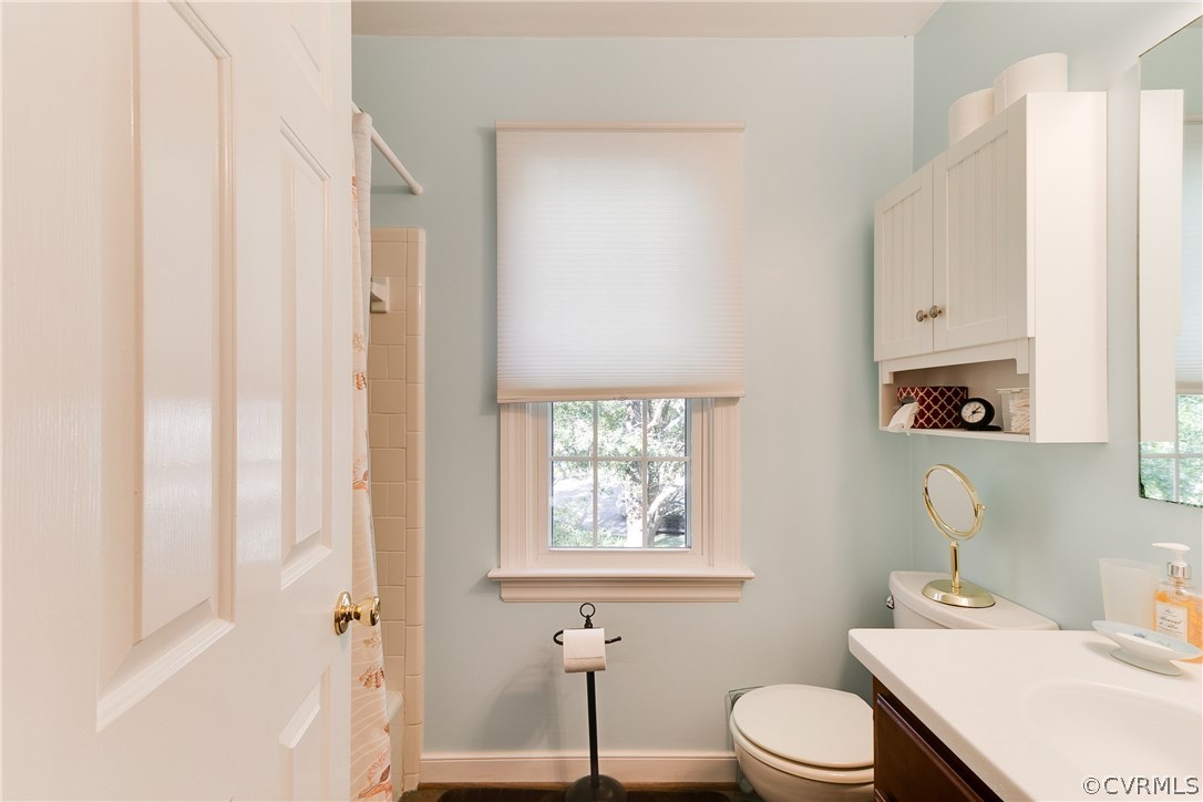 2512 Tanglebrook Road Midlothian, VA 23112 - Photo 15 of 23 a bathroom with a sink a toilet and a window