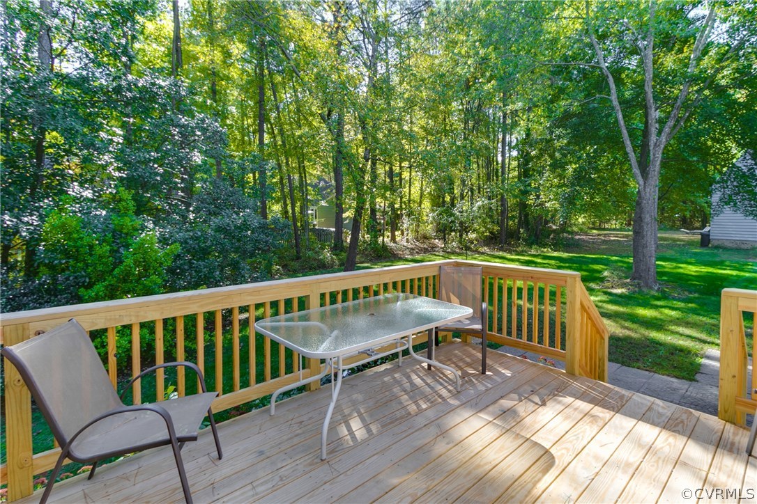 2512 Tanglebrook Road Midlothian, VA 23112 - Photo 23 of 23 a view of a chair and table on the wooden deck