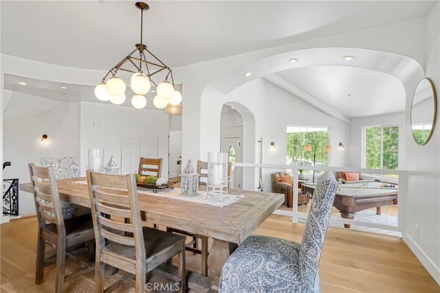 a view of entryway and hall with dining room