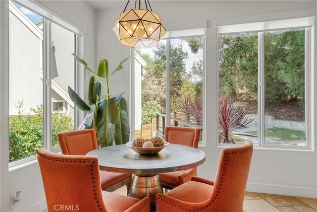 a view of a livingroom with furniture and a flat screen tv