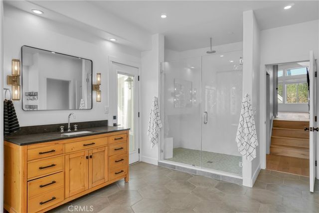 a view of a balcony with furniture and a potted plant