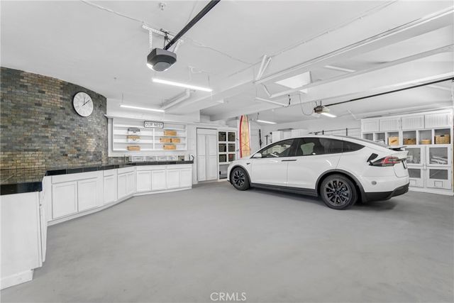 a view of a garage with a car parked