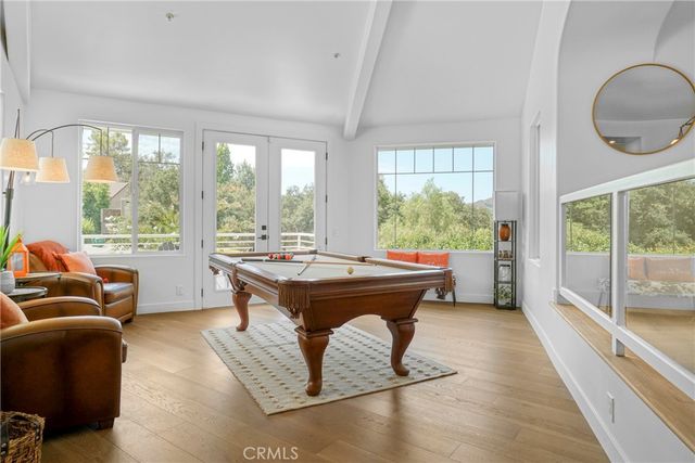 a living room with large windows and couch