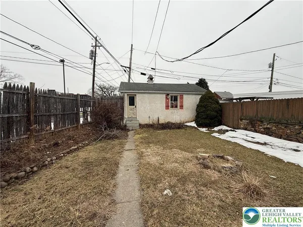 a house view with a backyard