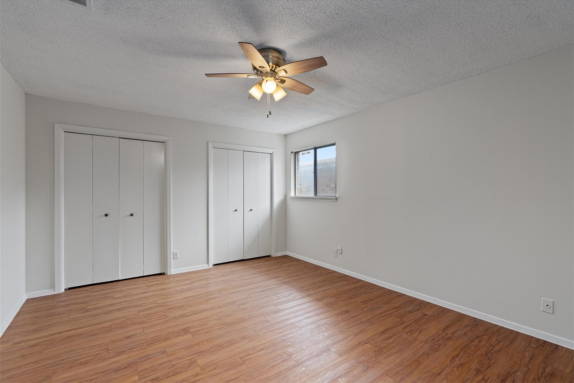 3426 Willowrun Drive, Unit B Austin, TX 78704 - Photo 11 of 16 a view of an empty room with wooden floor