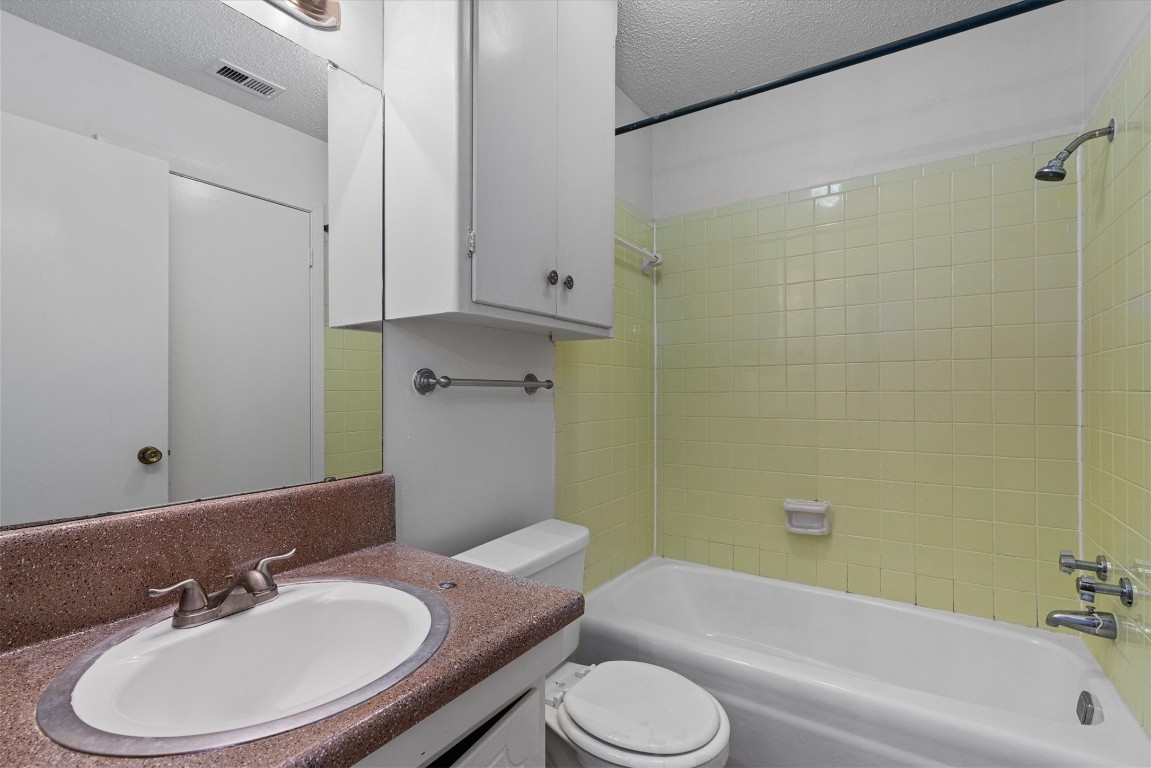 3426 Willowrun Drive, Unit B Austin, TX 78704 - Photo 13 of 16 a bathroom with a sink toilet and shower