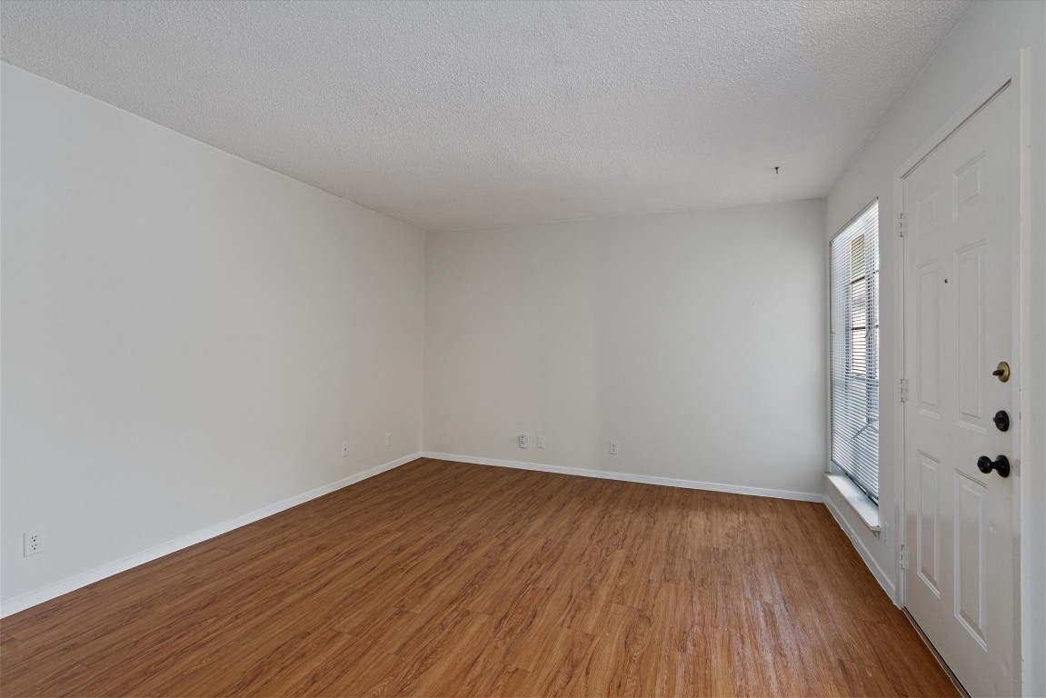 3426 Willowrun Drive, Unit B Austin, TX 78704 - Photo 3 of 16 a view of a room with wooden floor