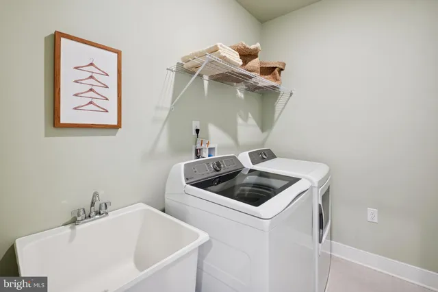 a bathroom with a sink and washing machine