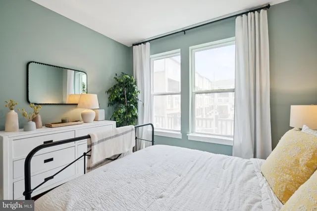 a bedroom with furniture and a window