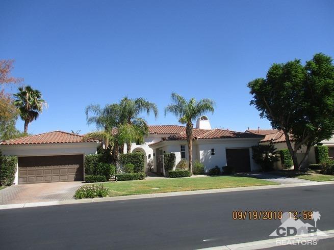 324 Loch Lomond Road Rancho Mirage, CA 92270 - Photo 2 of 51 a view of a house with a yard and a garage