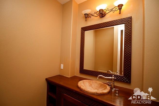 324 Loch Lomond Road Rancho Mirage, CA 92270 - Photo 25 of 51 a bathroom with a granite countertop sink and a mirror