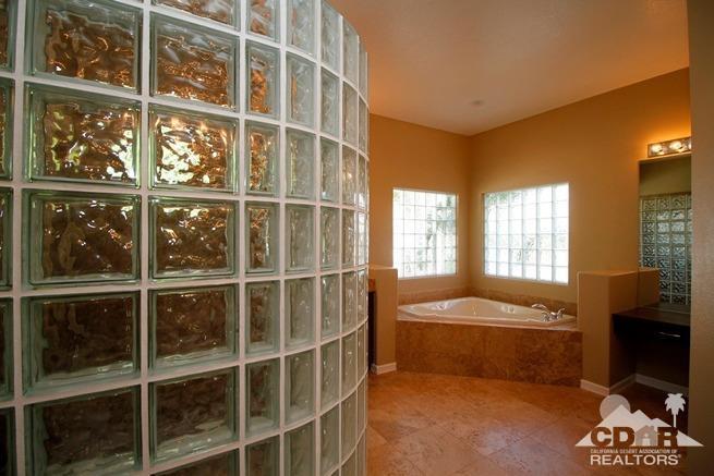 324 Loch Lomond Road Rancho Mirage, CA 92270 - Photo 29 of 51 a bedroom with a bed and a window